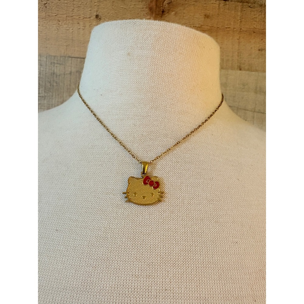 Sanrio Hello Kitty Gold Tone Textured Pendant Necklace Red Bow